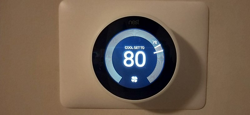 Nest learning thermostat in living room